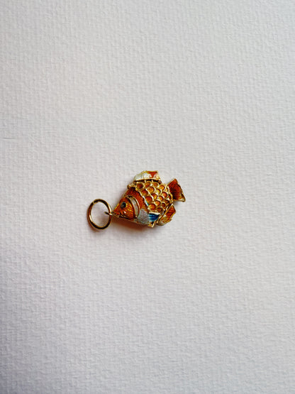 A Fish Anklet featuring a cloisonné fish charm is displayed on a white surface.