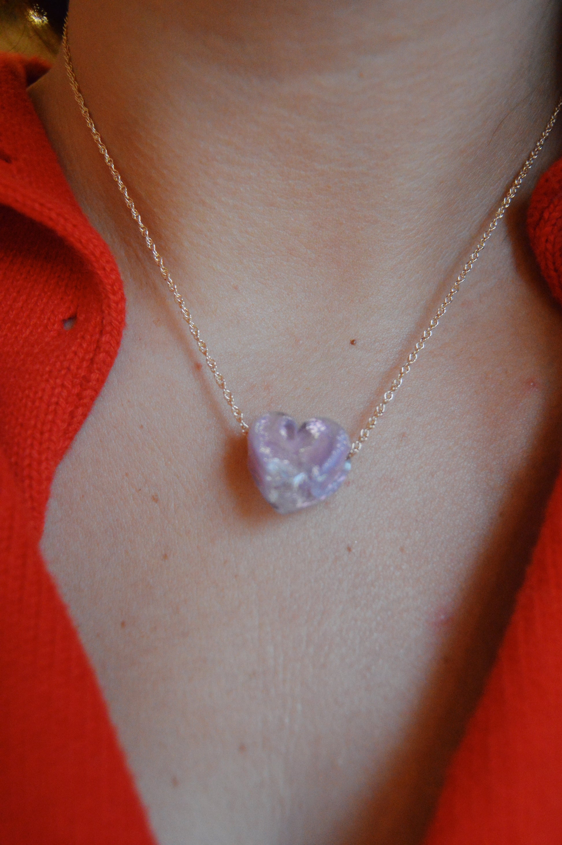 The Glass Heart Necklaces- Purples feature a handmade lampwork glass heart on a gold-filled chain, highlighting the elegance of artisan jewelry for any wearer.
