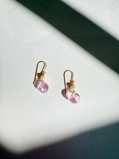 Bubble Minis: Gold hook earrings with freshwater pearls and light purple gemstone drops, featuring gold filled findings and displayed on a white surface with diagonal shadows in the background.