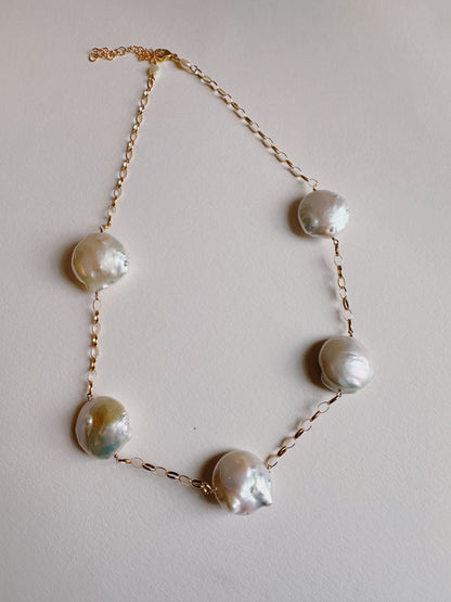The Chunky Pearl Layer is a gold chain necklace with five large, irregular freshwater pearls spaced along a 14k gold filled chain, shown on a plain light background.