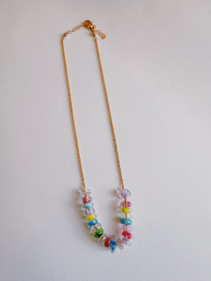 The Lots of Donuts Layer is a necklace featuring colorful, handblown glass beads and gold filled findings.