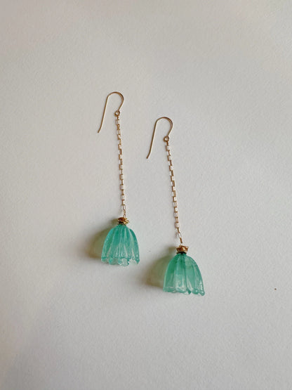 Glass Tulip Earrings in Seaside: long 14k gold-filled chains with handmade light blue-green lampwork tulip charms, shown on a plain white background.