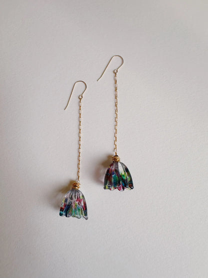 Glass Tulip Earrings in Tie Dye feature long 14k gold-filled chains and delicate handmade multicolored glass lampwork tulip pendants, shown on a plain white background.
